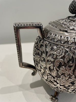 Lot 206 - A KUTCH SILVER TEASET, OOMERSI MAWJI OF BHUJ, WESTERN INDIA, 1880-1890