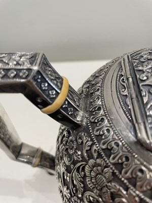 Lot 206 - A KUTCH SILVER TEASET, OOMERSI MAWJI OF BHUJ, WESTERN INDIA, 1880-1890