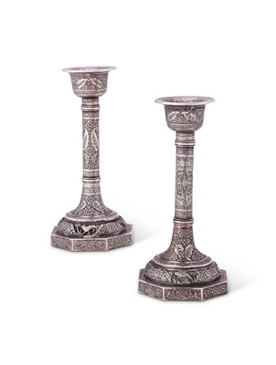 Lot 112 - A PAIR OF IRANI SILVER CANDLESTICKS, PROBABLY ISFAHAN, MID 20TH CENTURY