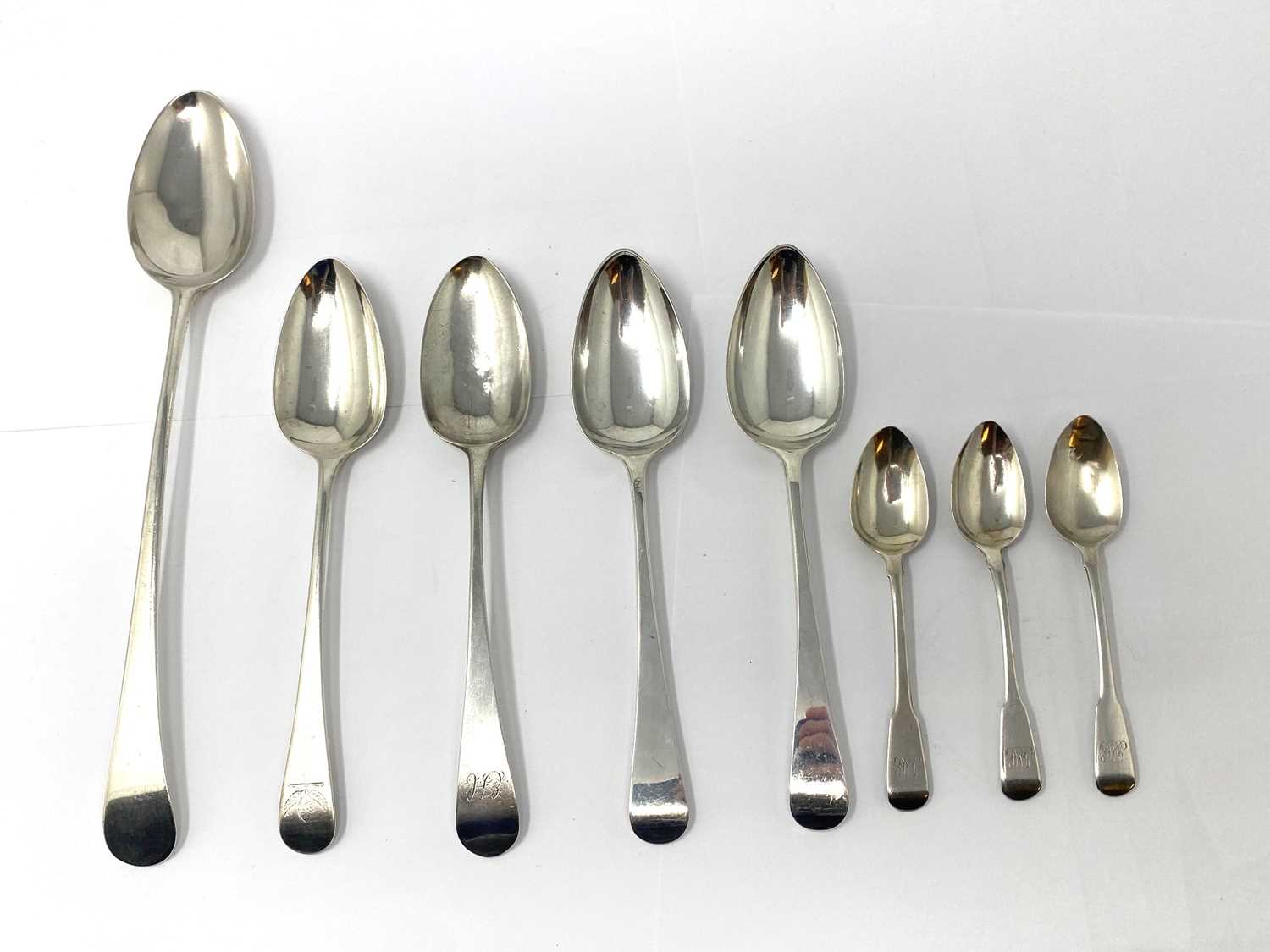 Lot 558 - A GEORGE III SILVER GRAVY SPOON AND FOUR TABLESPOONS, VARIOUS MAKERS, LONDON, 1791-1803