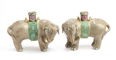 Lot 29 - A PAIR OF CHINESE EXPORT FAMILLE-ROSE 'ELEPHANT' CANDLE-HOLDERS, LATE QING DYNASTY (1644-1911)
