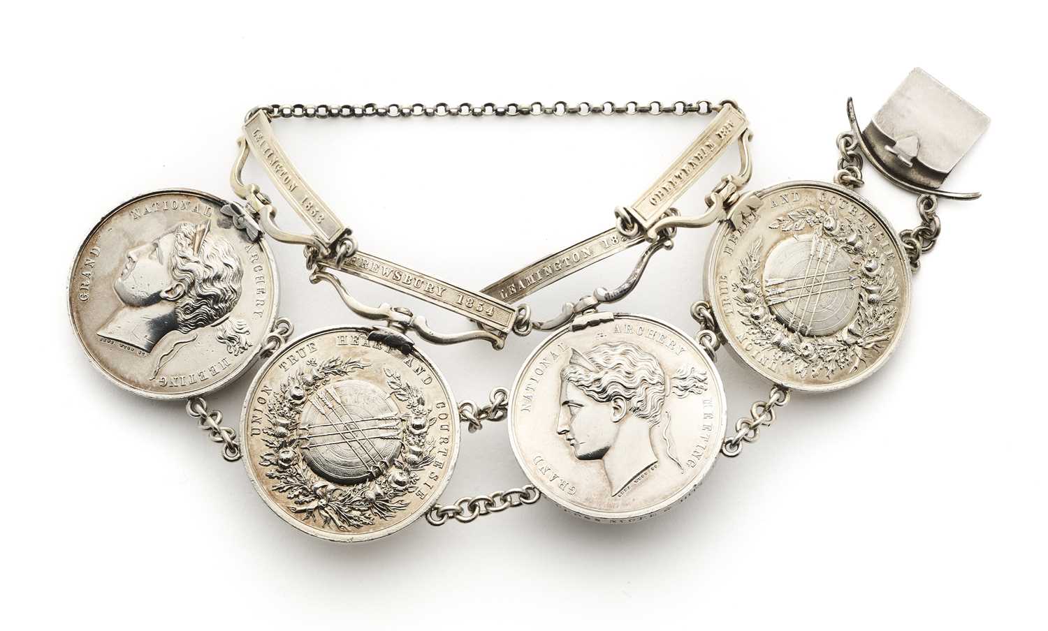 Lot 62 - FOUR GRAND NATIONAL ARCHERY MEETING MEDALS FORMED AS A SILVER BRACELET, 1852-83