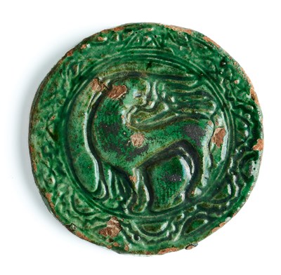 Lot 163 - A CIRCULAR RELIEF TILE, PROBABLY GHAZNI, AFGHANISTAN, CIRCA 1200