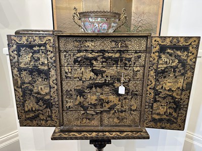 Lot 32 - A GOOD CHINESE EXPORT GILT DECORATED BLACK LACQUER COLLECTOR'S CABINET ON STAND, CIRCA 1815