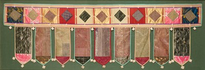 Lot 173 - A CLOTH DOOR HANGING (TORANA), GUJARAT, WESTERN INDIA, 20TH CENTURY