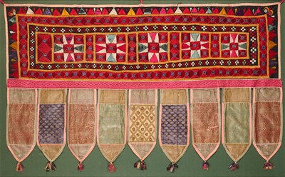 Lot 174 - A CLOTH DOOR HANGING (TORANA), GUJARAT, WESTERN INDIA, CIRCA 1900