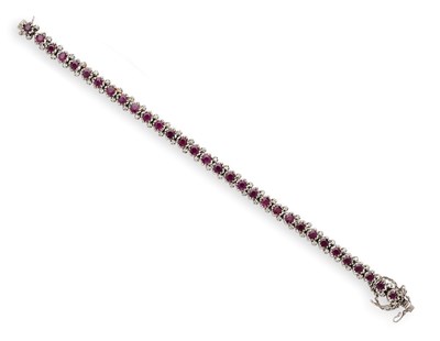 Lot 412 - RUBY AND DIAMOND LINE BRACELET, 1970s