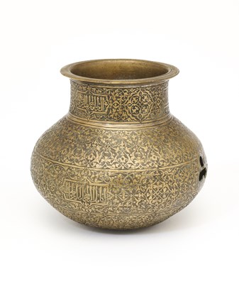 Lot 94 - AN ENGRAVED BRASS EWER, PROBABLY DECCAN, SOUTHERN INDIA, CIRCA 1500