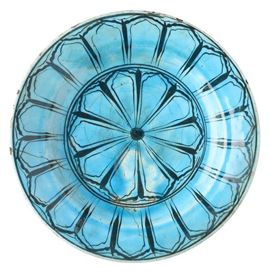 Lot 130 - A SAFAVID BLACK PAINTED TURQUOISE 'KUBACHI' DISH, PERSIA, LATE 17TH CENTURY