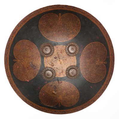 Lot 128 - AN HIDE SHIELD (DHAL), NORTHERN INDIA, 19TH CENTURY