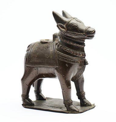 Lot 34 - A BRONZE FIGURE OF NANDI BULL, TAMIL NADU, SOUTH INDIA, 18TH/19TH CENTURY