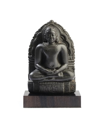 Lot 176 - A SMALL JAIN CARVED BLACK STONE FIGURE OF CANDRAPRABHA, KARNATAKA, 12TH CENTURY