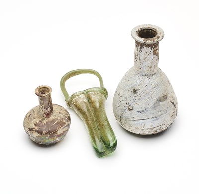 Lot 48 - THREE ROMAN GLASS VESSELS, CIRCA 2ND-4TH CENTURY A.D.