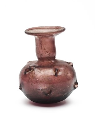 Lot 68 - A ROMAN PURPLE GLASS SPRINKER FLASK, CIRCA 3RD/4TH CENTURY A.D.