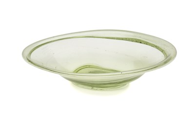 Lot 54 - A ROMAN MOSS GREEN GLASS OVAL DISH, CIRCA 4TH-5TH CENTURY A.D.