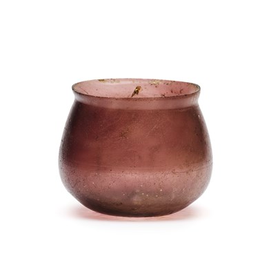 Lot 76 - A ROMAN MANGANESE PURPLE GLASS BEAKER, CIRCA 1ST CENTURY A.D.