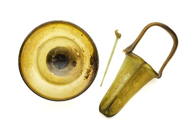 Lot 57 - TWO ROMAN AMBER GLASS VESSELS, CIRCA 3RD-4TH CENTURY A.D.