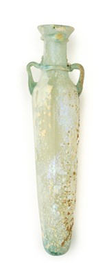 Lot 74 - A ROMAN PALE GREEN ELONGATED GLASS FLASK, CIRCA 3RD-4TH CENTURY A.D.