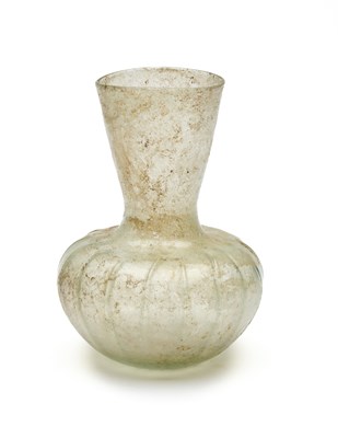 Lot 72 - A ROMAN PALE GREEN GLASS JAR, CIRCA 2ND-4TH CENTURY A.D.