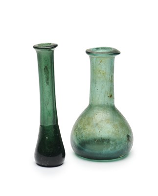 Lot 69 - TWO ROMAN DARK GREEN GLASS UNGUENTARIA, CIRCA 2ND CENTURY A.D.