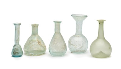 Lot 59 - FIVE PALE BLUE AND GREEN GLASS VESSELS, CIRCA 2ND-4TH CENTURY A.D.