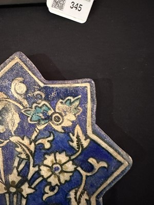 Lot 345 - AN ILKHANID STAR TILE, PERSIA, 14TH CENTURY