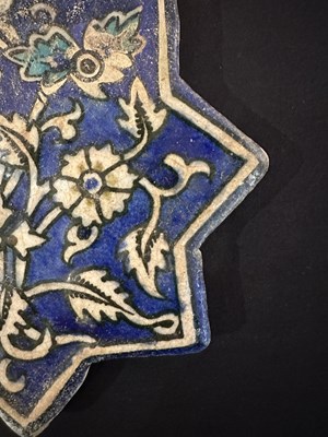 Lot 345 - AN ILKHANID STAR TILE, PERSIA, 14TH CENTURY