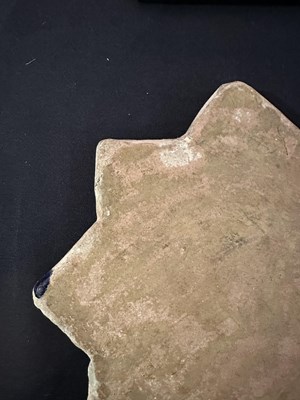 Lot 345 - AN ILKHANID STAR TILE, PERSIA, 14TH CENTURY