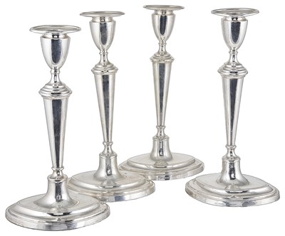 Lot 414 - A SET FOUR GEORGE V SILVER CANDLESTICKS
