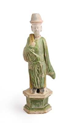 Lot 57 - A CHINESE GREEN AND AMBER-GLAZED ATTENDANT, MING DYNASTY, 15/16TH CENTURY