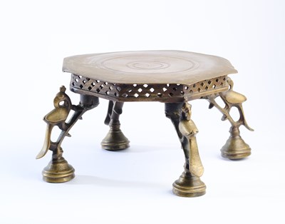 Lot 443 - A BRASS FOOTED STAND, INDIA, CIRCA 1900