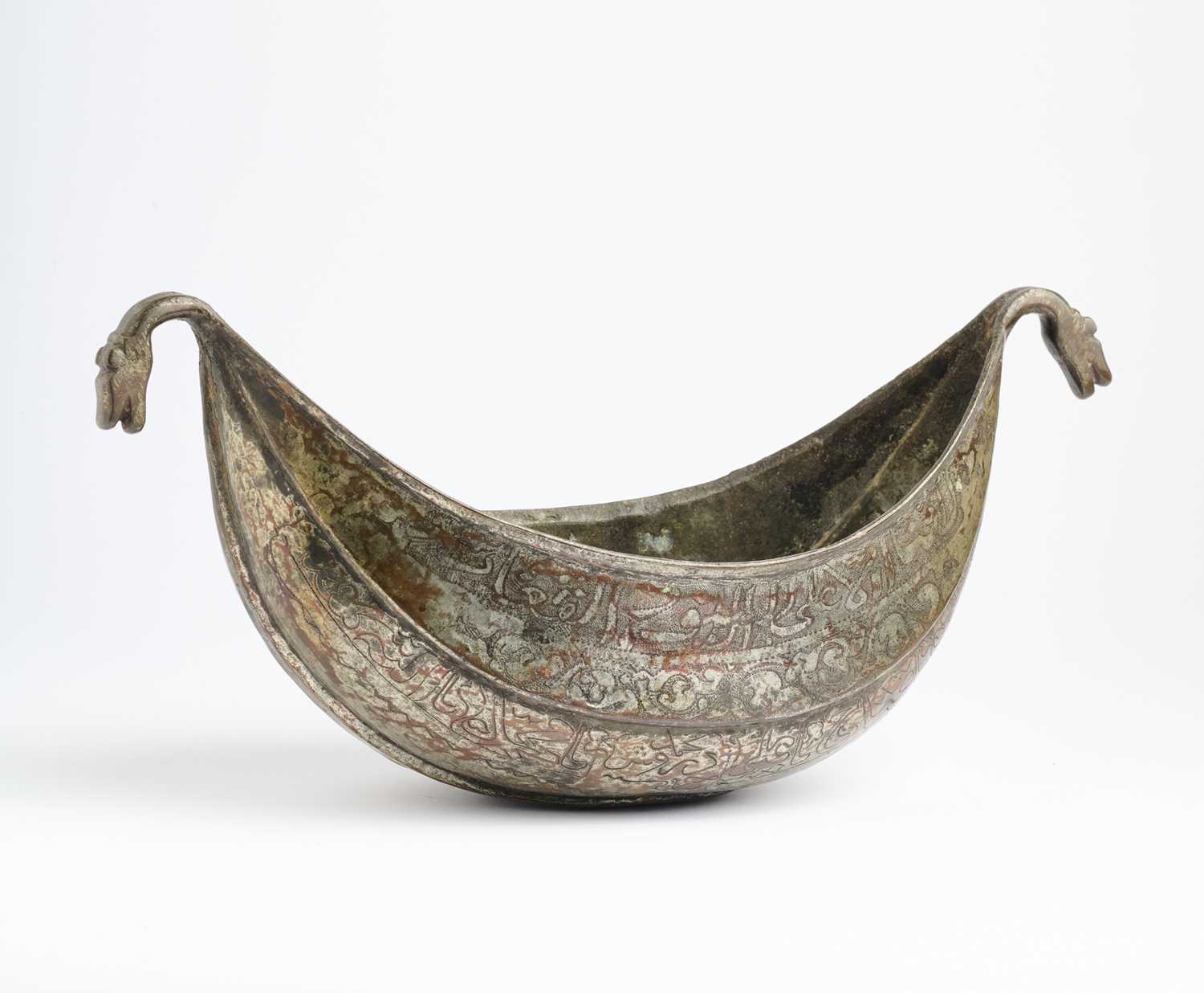 Lot 377 - A QAJAR TINNED COPPER KASHKUL, PERSIA, 19TH CENTURY