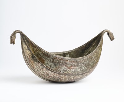 Lot 377 - A QAJAR TINNED COPPER KASHKUL, PERSIA, 19TH CENTURY