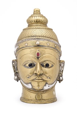Lot 135 - A LARGE SILVER-INLAID SIVA MASK, WESTERN DECCAN, 19TH CENTURY