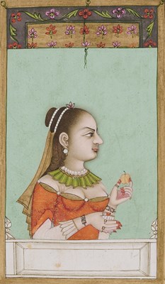 Lot 329 - A LADY IN EUROPEAN DRESS HOLDING AN FRUIT, MUGHAL, PROBABLY LUCKNOW, 18TH CENTURY