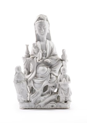 Lot 16 - A CHINESE DEHUA SEATED GUANYIN AND ATTENDANTS, 17TH CENTURY