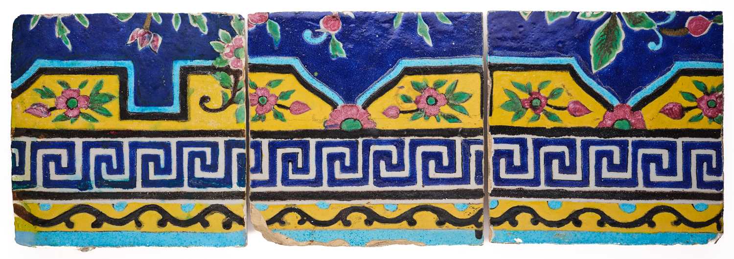 Lot 379 - THREE QAJAR CUERDA SECA BORDER TILES, PERSIA, 19TH CENTURY