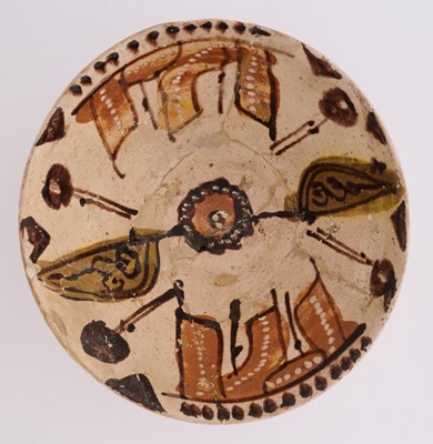 Lot 78 - A NISHAPUR SLIP-PAINTED POTTERY BOWL, PERSIA OR CENTRAL ASIA, CIRCA 10TH CENTURY