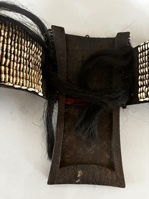 Lot 525 - AN AFRICAN (TUAREG) LEATHER BAG, AND A NAGA DAO HOLDER AND BELT, BOTH LATE 19TH/EARLY 20TH CENTURY