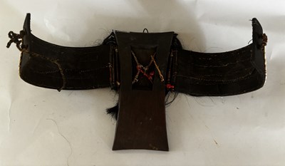 Lot 525 - AN AFRICAN (TUAREG) LEATHER BAG, AND A NAGA DAO HOLDER AND BELT, BOTH LATE 19TH/EARLY 20TH CENTURY