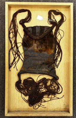 Lot 525 - AN AFRICAN (TUAREG) LEATHER BAG, AND A NAGA DAO HOLDER AND BELT, BOTH LATE 19TH/EARLY 20TH CENTURY