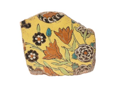 Lot 110 - A MUGHAL TILE FRAGMENT FROM THE GATEWAY TO THE TOMB OF MADANI, SRINAGAR, MID-17TH CENTURY