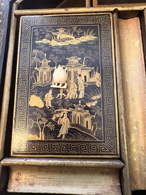 Lot 79 - A CHINESE EXPORT LACQUER GAMES BOX AND HINGED COVER, QING DYNASTY, 19TH CENTURY
