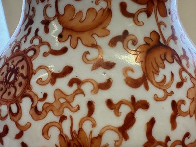 Lot 76 - A CHINESE IRON-RED 'LOTUS' VASE, QING DYNASTY, 19TH CENTURY
