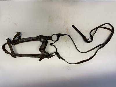Lot 2 - A TIBETAN SADDLE, BRIDLE, AND A PAIR OF STIRRUPS, 18TH/19TH CENTURY OR EARLIER