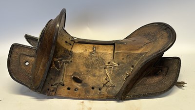 Lot 2 - A TIBETAN SADDLE, BRIDLE, AND A PAIR OF STIRRUPS, 18TH/19TH CENTURY OR EARLIER