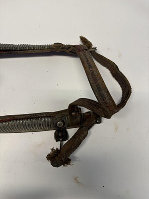 Lot 2 - A TIBETAN SADDLE, BRIDLE, AND A PAIR OF STIRRUPS, 18TH/19TH CENTURY OR EARLIER