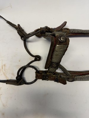 Lot 2 - A TIBETAN SADDLE, BRIDLE, AND A PAIR OF STIRRUPS, 18TH/19TH CENTURY OR EARLIER