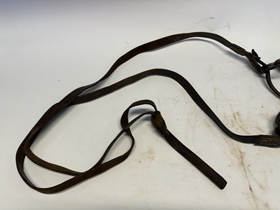 Lot 2 - A TIBETAN SADDLE, BRIDLE, AND A PAIR OF STIRRUPS, 18TH/19TH CENTURY OR EARLIER