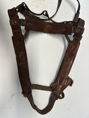 Lot 2 - A TIBETAN SADDLE, BRIDLE, AND A PAIR OF STIRRUPS, 18TH/19TH CENTURY OR EARLIER